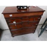 A mahogany chest of drawers.