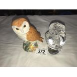 A Beswick owl and a Royal Crystal rock owl.