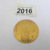 An Austrian 24ct gold 4 Ducat coin (14 grams).