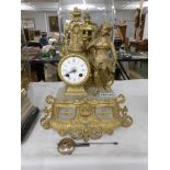 A French gilt clock surmounted farm worker.