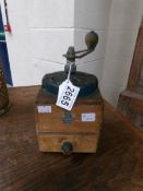 A vintage coffee grinder.