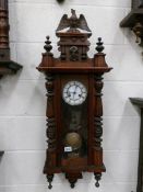 A Victorian mahogany 8 day wall clock, in working order.