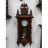 A Victorian mahogany 8 day wall clock, in working order.