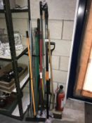 A quantity of garden tools including fork, spade, hoe etc.