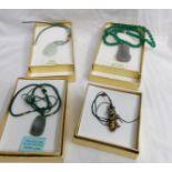 3 jade Buddha pendants and a stone rabbit pendant.