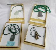 3 jade Buddha pendants and a stone rabbit pendant.