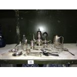 A collection of silver plate items including coffee pot, tongs etc.