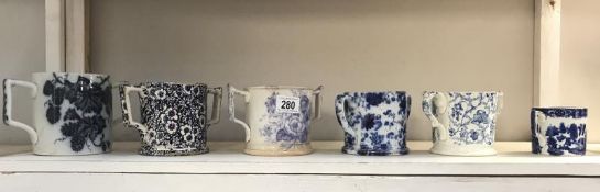 6 'blue glaze' Botanical design, loving cups, circa 19th century.