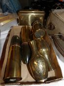 A collection of brass trench art items.