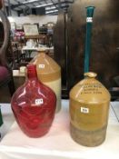 2 large stoneware flagon's (A/F) and 2 large glass items