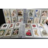 2 albums containing approximately 800 larger cigarette cards mainly Player's and Will's but