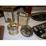 A brass carriage clock and 3 other clocks.