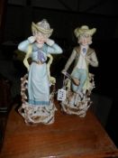 A pair of continental bisque porcelain figures.