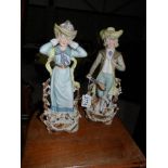 A pair of continental bisque porcelain figures.