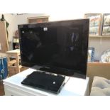 A Samsung flat screen TV and a Toshiba DVD player