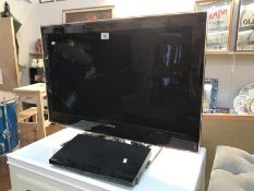 A Samsung flat screen TV and a Toshiba DVD player