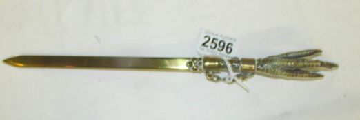 A letter opener with claw handle.