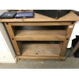 A dark stained pine bookcase