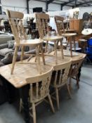 A pine kitchen table and 6 chairs.