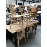 A pine kitchen table and 6 chairs.