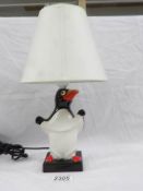An original Carlton ware penguin table lamp with shade.