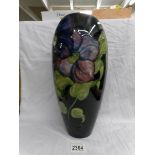 A tall Moorcroft vase (36.5 cm).