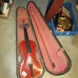 An early violin in wooden case.