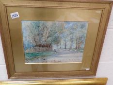 A framed and glazed watercolour rural scene with shepherd and sheep, signed R E Tapp.