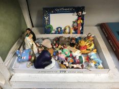 A quantity of Disney Christmas ornaments (2 AF) and a 2001 Disney photo frame.