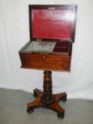 A Victorian rosewood tea table / teapoy on stand with 2 tea caddies.