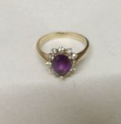 A 9ct gold ring set diamonds and central pear shaped amethyst, size O half, gross weight 3 grams.