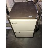 A 2 drawer filing cabinet.