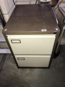 A 2 drawer filing cabinet.