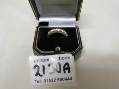 An 18kt gold ring set half band of 7 diamonds, size O half, gross weight 4 grams.