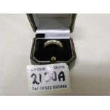 An 18kt gold ring set half band of 7 diamonds, size O half, gross weight 4 grams.