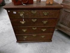 An oak 4 drawer chest.