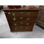 An oak 4 drawer chest.