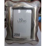 A modern silver photo frame (marked 925).