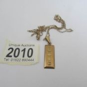 A 9ct gold ingot on a 9ct gold chain (7 grams).