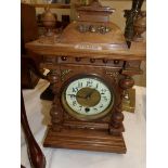 An oak mantel clock.