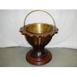 A circular Victorian mahogany planter with scalloped edge complete with brass liner.