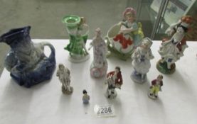 A Blue Burleigh Toby jug and a mixed lot of figures.