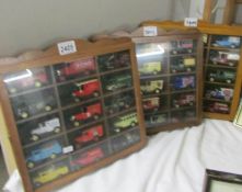 3 display cases of die cast commercial vehicles.