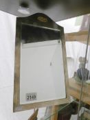 A bevel edged table mirror set in silver frame (hall marked Walker & Hall,