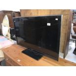 A 37 inch Panasonic flat screen tv (remote in office)