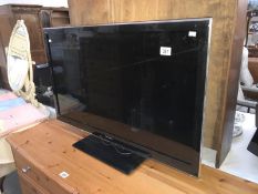 A 37 inch Panasonic flat screen tv (remote in office)