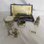 8 items of silver including cased spoon with pusher, thimbles, pepper pot,