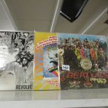 3 Beatles LP records: Magical Mystery Tour with booklet, Sergeant Pepper and Revolver.