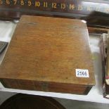 A small oak slope front writing box.