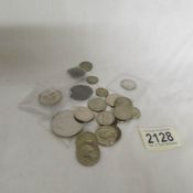 Approximately 25 USA and foreign coins.